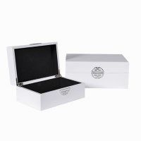 Set of two white gloss finish boxes with oriental style detail in ...